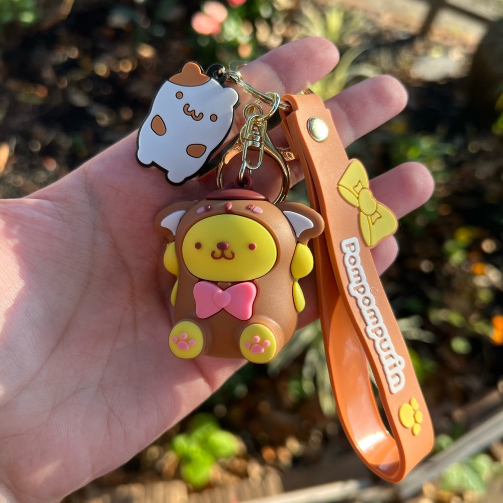 Hand Crafted Adorable Hello Kitty Sanrio pompompurin keychain with stickers 💜